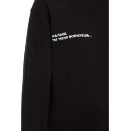 Black sweatshirt with printed sign